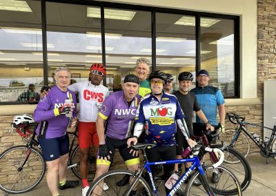 NWCC Vintage Park Starbucks Ride 42 Group of cyclists posing outside Northwest Cycling Club event with bikes and gear in Houston, TX.