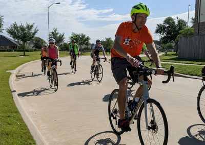 Bike riders participating in Northwest Cycling Club outdoor community cycling event.