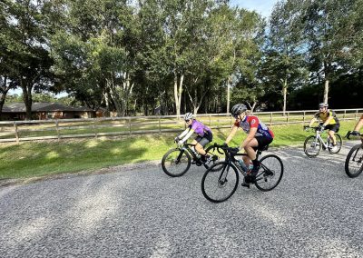 NWCC Vintage Park Starbucks Ride 40 Cyclists riding together on a scenic outdoor trail during daytime.