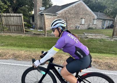 NWCC Vintage Park Starbucks Ride 46 Bike rider in purple NWCC cycling jersey on road, emphasizing Northwest Cycling Club cycling events and community.