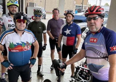 NWCC Vintage Park Starbucks Ride 43 Group of cyclists gathered outside a store ready for a ride, showcasing active cycling community in Northwest.