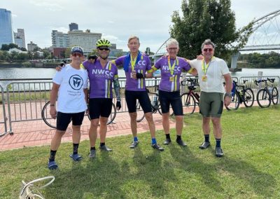 Group of cyclists from Northwest Cycling Club enjoying a ride near Houston skyline.