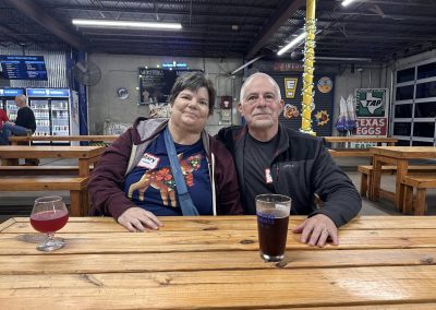 Cycling In Houston - NWCC Recent Activities Gallery 634 Enjoying post-ride drinks at Northwest Cycling Club event, showcasing camaraderie and cycling community.