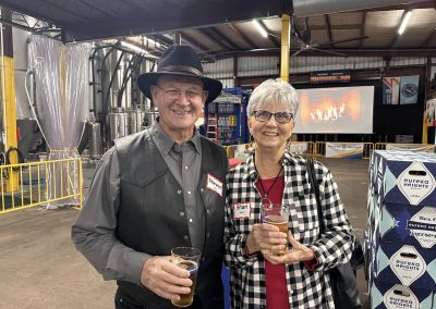 Cycling In Houston - NWCC Recent Activities Gallery 637 Enjoying drinks at the Northwest Cycling Club event, connecting with fellow cyclists, in a vibrant indoor setting.