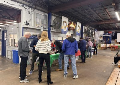 Cycling In Houston - NWCC Recent Activities Gallery 644 People browsing a holiday event at Northwest Cycling Club community center.