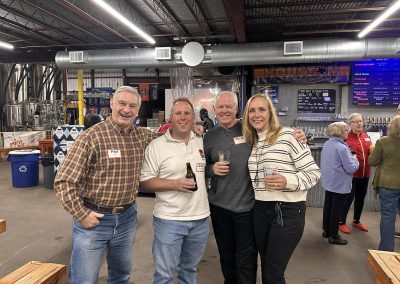 Cycling In Houston - NWCC Recent Activities Gallery 627 Group of cyclists enjoying drinks at Northwest Cycling Club event in a brewery setting.