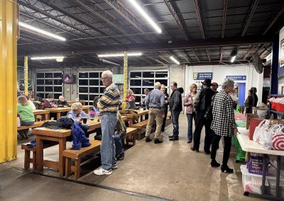 Cycling In Houston - NWCC Recent Activities Gallery 611 A lively indoor gathering at Northwest Cycling Club event with people socializing and dining.