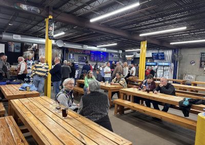 Cycling In Houston - NWCC Recent Activities Gallery 620 Indoor social gathering at Northwest Cycling Club bike event, with attendees enjoying drinks and conversations.