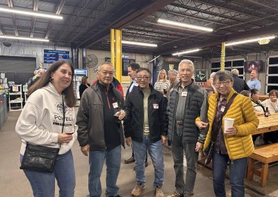 Cycling In Houston - NWCC Recent Activities Gallery 616 Friendly cyclists socializing at Northwest Cycling Club community event indoors.
