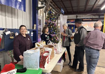 Cycling In Houston - NWCC Recent Activities Gallery 642 Festive holiday event at Northwest Cycling Club with Christmas tree and gift exchange for community members.