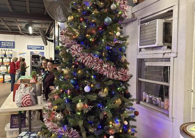 Cycling In Houston - NWCC Recent Activities Gallery 612 Festive Christmas tree decorated with ornaments and lights at Northwest Cycling Club event.