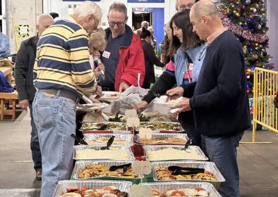Cycling In Houston - NWCC Recent Activities Gallery 610 All-you-can-eat buffet at Northwest Cycling Club holiday event, variety of delicious foods.