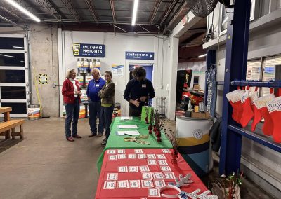 Cycling In Houston - NWCC Recent Activities Gallery 626 Friendly cyclists at Northwest Cycling Club holiday event inside NWCC bike shop.