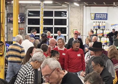Cycling In Houston - NWCC Recent Activities Gallery 605 1. Diverse group of people at Northwest Cycling Club event in a warehouse setting.