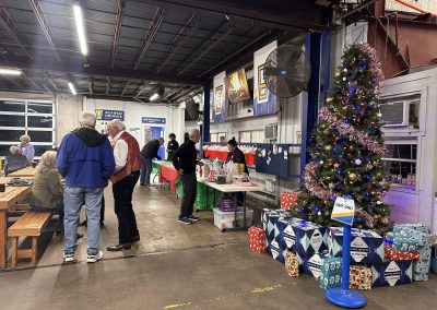 Cycling In Houston - NWCC Recent Activities Gallery 647 Festive holiday event at Northwest Cycling Club with Christmas tree, gift exchanges, and community gathering.