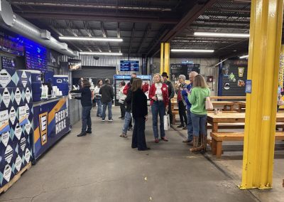 Cycling In Houston - NWCC Recent Activities Gallery 648 Indoor visit to Northwest Cycling Club beer and food festival, with people enjoying the event.