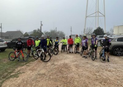 Cycling In Houston - NWCC Recent Activities Gallery 585 Group of cyclists in NWCC cycling gear during a morning ride on a foggy day.