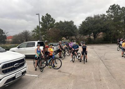 Cycling In Houston - NWCC Recent Activities Gallery 567 Group of cyclists at Northwest Cycling Club gathering in a parking lot, ready for a bike ride.