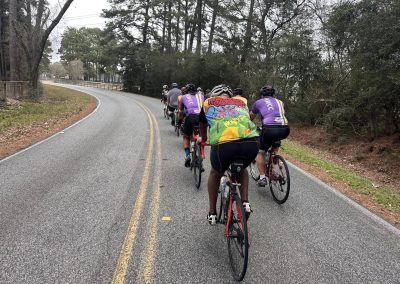 Cycling In Houston - NWCC Recent Activities Gallery 560 Group cycling ride on scenic open-road trail, vibrant cycling attire, Northwest Cycling Club event.