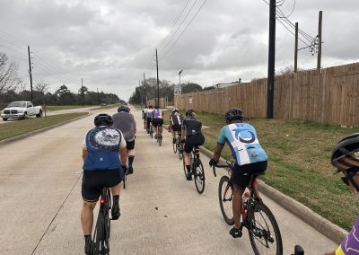 Cycling In Houston - NWCC Recent Activities Gallery 561 Cycling group riding on urban street with Northwest Cycling Club members, practicing safe cycling routes.