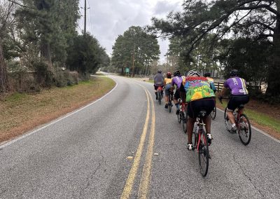 Cycling In Houston - NWCC Recent Activities Gallery 559 Cycling group riding on scenic rural mountain road for Northwest Cycling Club event.