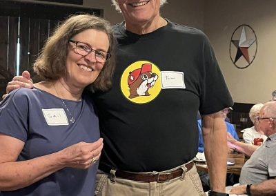 Cycling In Houston - NWCC Recent Activities Gallery 539 Smiling woman and man posing at Northwest Cycling Club event, showcasing community and camaraderie in cycling.