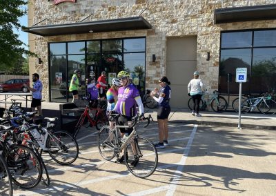 Cycling In Houston - NWCC Recent Activities Gallery 524 Group of cyclists at Northwest Cycling Club gathering outside coffee shop.