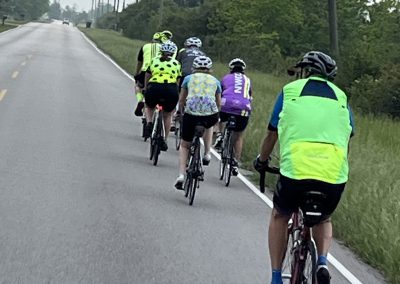 Cycling In Houston - NWCC Recent Activities Gallery 518 Cycling group riding on rural road with Northwest Cycling Club keywords.