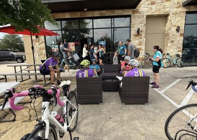 Cycling In Houston - NWCC Recent Activities Gallery 512 Cycling group gathers outside a coffee shop in the Northwest Cycling Club community.