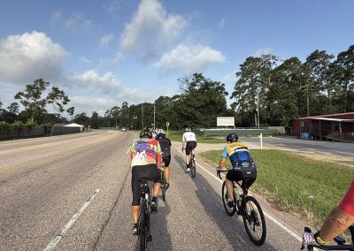 Cycling In Houston - NWCC Recent Activities Gallery 497 Experienced cyclists riding on scenic roads with Northwest Cycling Club in the background.