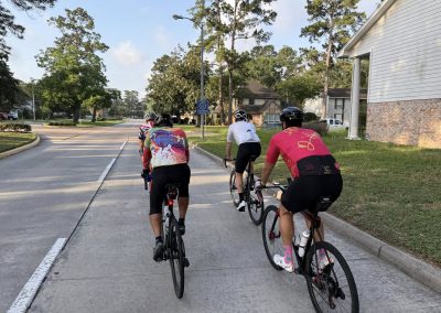 Cycling In Houston - NWCC Recent Activities Gallery 500 Group of cyclists riding together on a residential street - Northwest Cycling Club event.