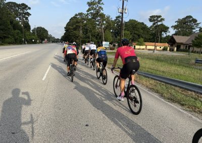 Cycling In Houston - NWCC Recent Activities Gallery 498 Cycling group on scenic rural road, Northwest Cycling Club, bike riding, outdoor fitness, community cyclists, NW cycling event.