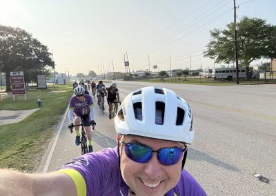Cycling In Houston - NWCC Recent Activities Gallery 482 Cycling group on a road ride with Northwest Cycling Club logo, outdoor biking event, community cycling activity.