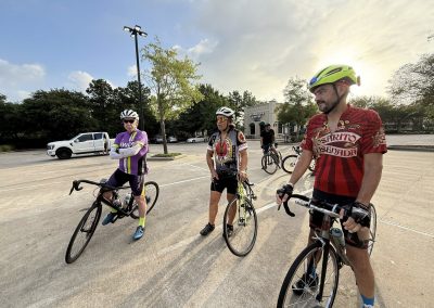 Cycling In Houston - NWCC Recent Activities Gallery 461 Cycling group members ready for ride in parking lot, sunny day, Northwest Cycling Club event.