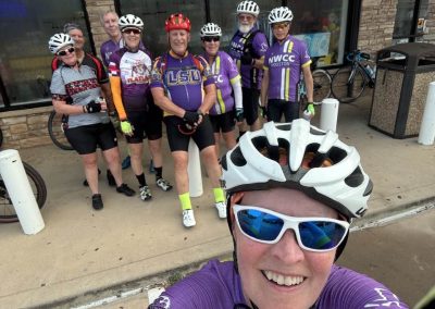 Cycling In Houston - NWCC Recent Activities Gallery 454 Group of cyclists from Northwest Cycling Club in colorful jerseys after a ride outdoor, smiling and ready for cycling adventure.