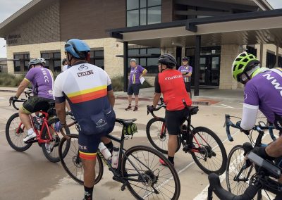 Cycling In Houston - NWCC Recent Activities Gallery 444 Cycling group preparing outside Northwest Cycling Club building for ride event.