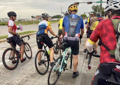 Cycling In Houston - NWCC Recent Activities Gallery 447 Cyclists at intersection during Northwest Cycling Club group ride in Portland Oregon.