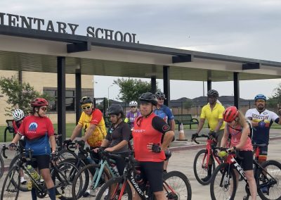 Cycling In Houston - NWCC Recent Activities Gallery 435 Cyclists gathered outside Northwest Cycling Club at elementary school for group ride.