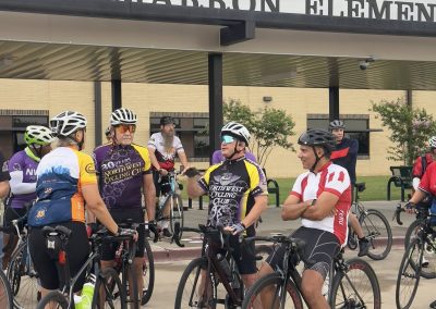 Cycling In Houston - NWCC Recent Activities Gallery 438 Cycling club members gather outside Tamaron Elementary School for a group ride event.