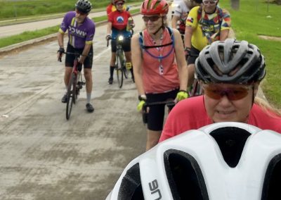 Cycling In Houston - NWCC Recent Activities Gallery 448 Group of cyclists on a ride with Northwest Cycling Club, wearing helmets and colorful jerseys.