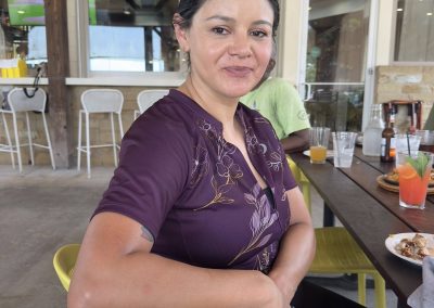 Cycling In Houston - NWCC Recent Activities Gallery 450 1. Woman enjoying a casual meal at Northwest Cycling Club café, a hub for local cyclists.