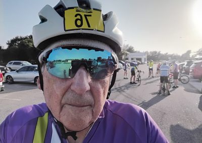 Cycling In Houston - NWCC Recent Activities Gallery 426 Adventure cyclist at Northwest Cycling Club event with group of bikers in background.