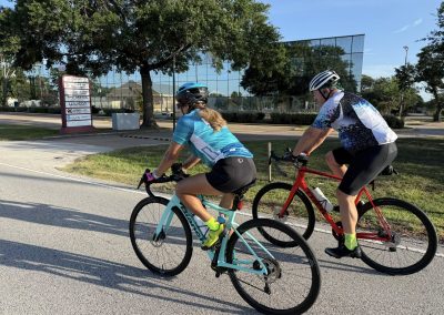 Cycling In Houston - NWCC Recent Activities Gallery 401 Cyclists riding outdoors during a NW Cycling Club event in a park setting.