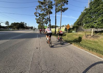 Cycling In Houston - NWCC Recent Activities Gallery 414 Cycling group riding on the road in Northwest Oregon, promoting outdoor biking and athletic community.