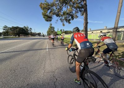 Cycling In Houston - NWCC Recent Activities Gallery 411 Bike riders participating in Northwest Cycling Club cycling event on open road outdoors.
