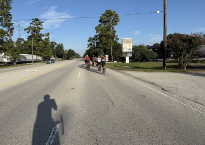 Cycling In Houston - NWCC Recent Activities Gallery 393 Cycling group on a road, part of Northwest Cycling Club, enjoying outdoor riding in scenic surroundings.