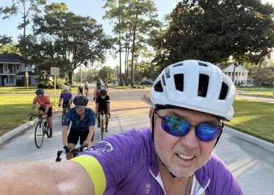 Cycling In Houston - NWCC Recent Activities Gallery 421 Cycling group riding in the neighborhood during daylight for Northwest Cycling Club event.