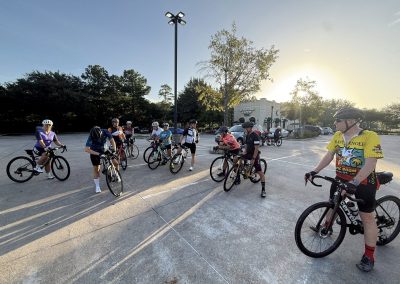 Cycling In Houston - NWCC Recent Activities Gallery 425 Group of cyclists gathering for a ride at Northwest Cycling Club event at sunset.