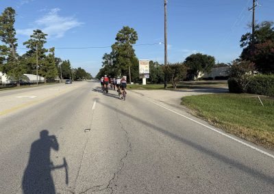 Cycling In Houston - NWCC Recent Activities Gallery 394 Cycling group riding on a scenic road with Northwest Cycling Club, outdoor biking adventure, group cycling event, healthy active lifestyle.