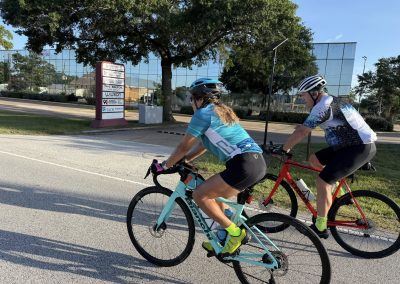 Cycling In Houston - NWCC Recent Activities Gallery 400 Vibrant cyclists riding on a sunny day with Northwest Cycling Club, showcasing group biking and outdoor fitness.